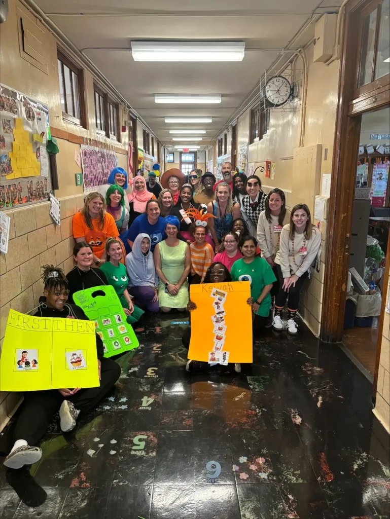 students in costumes in the school hallway