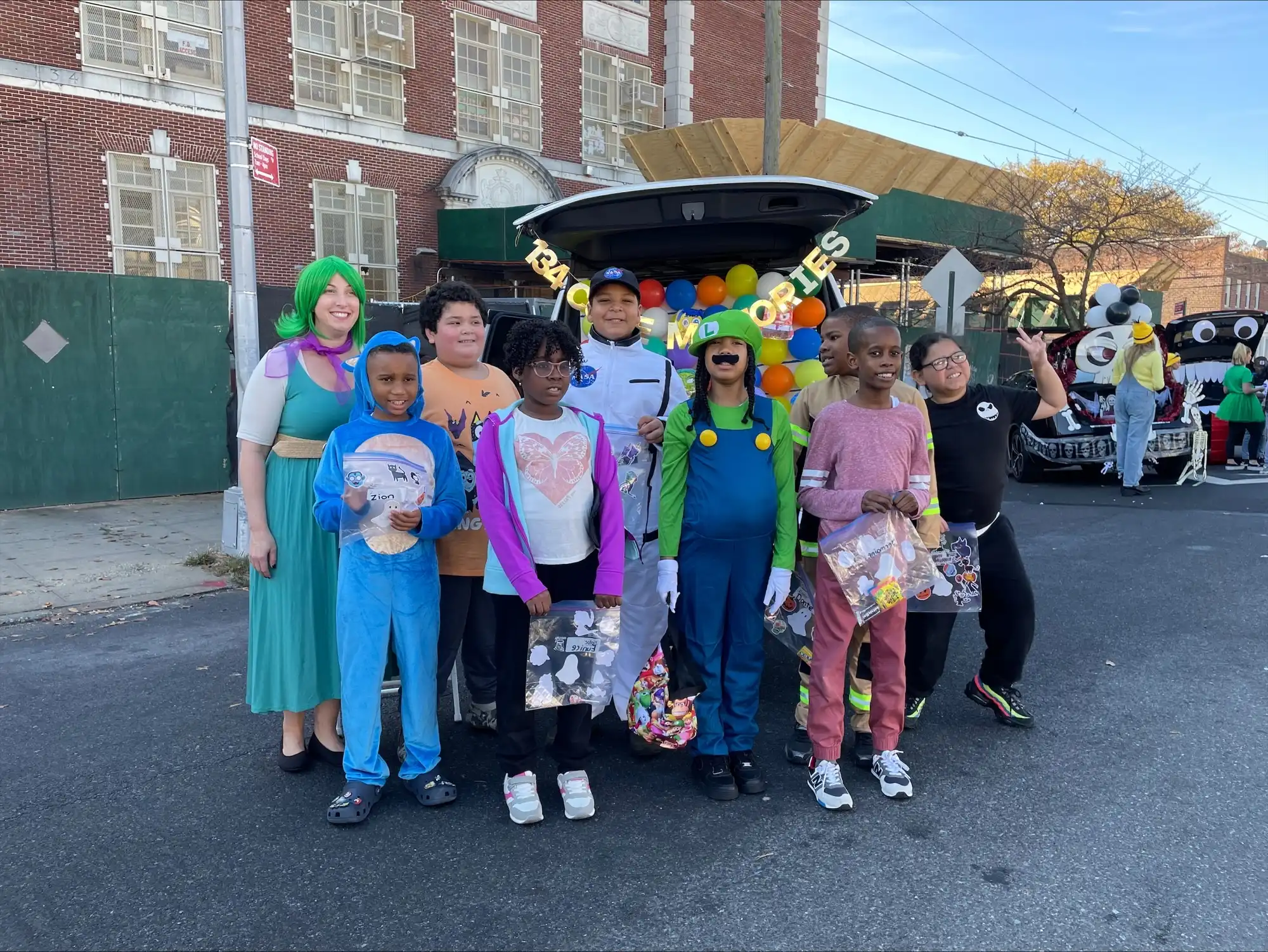 Students in Halloween costumes in the school yard