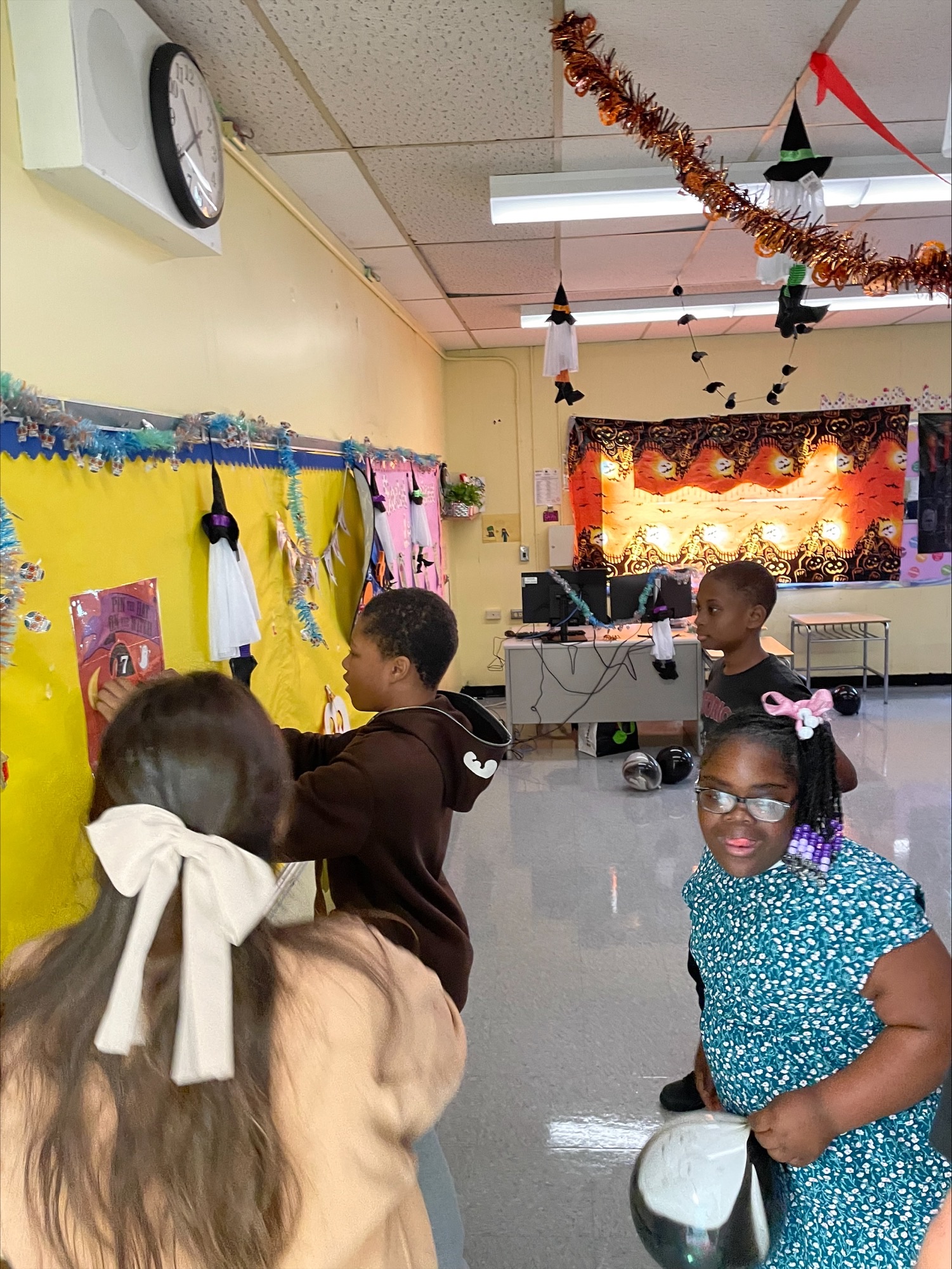 Students putting up fall decorations