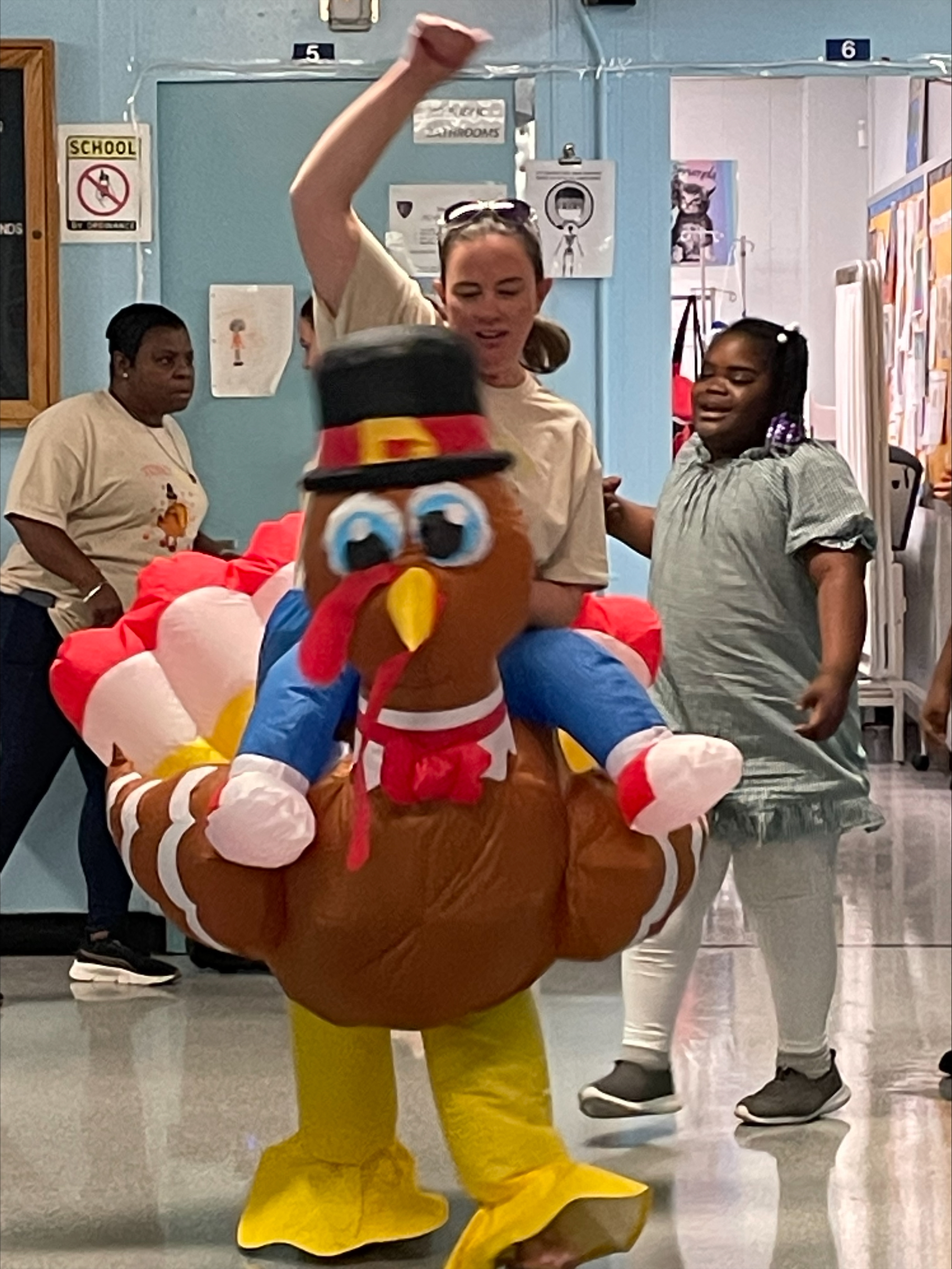 Teacher dressed as a turkey and her student