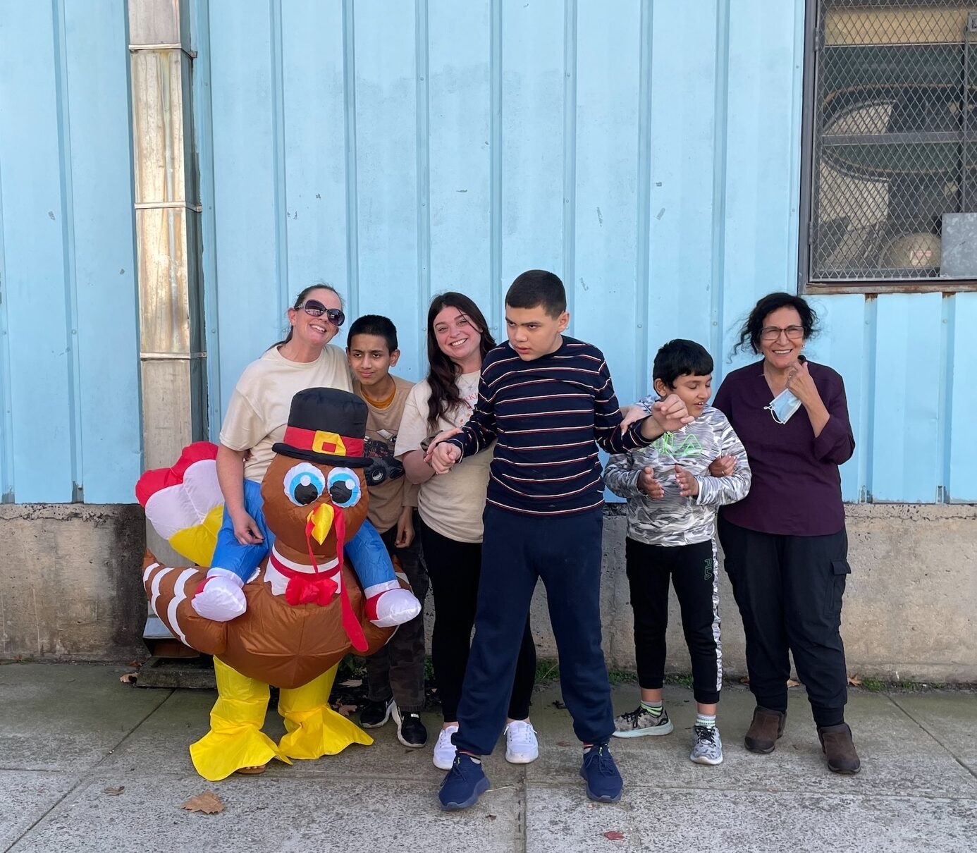 Students and their teacher in the school yard